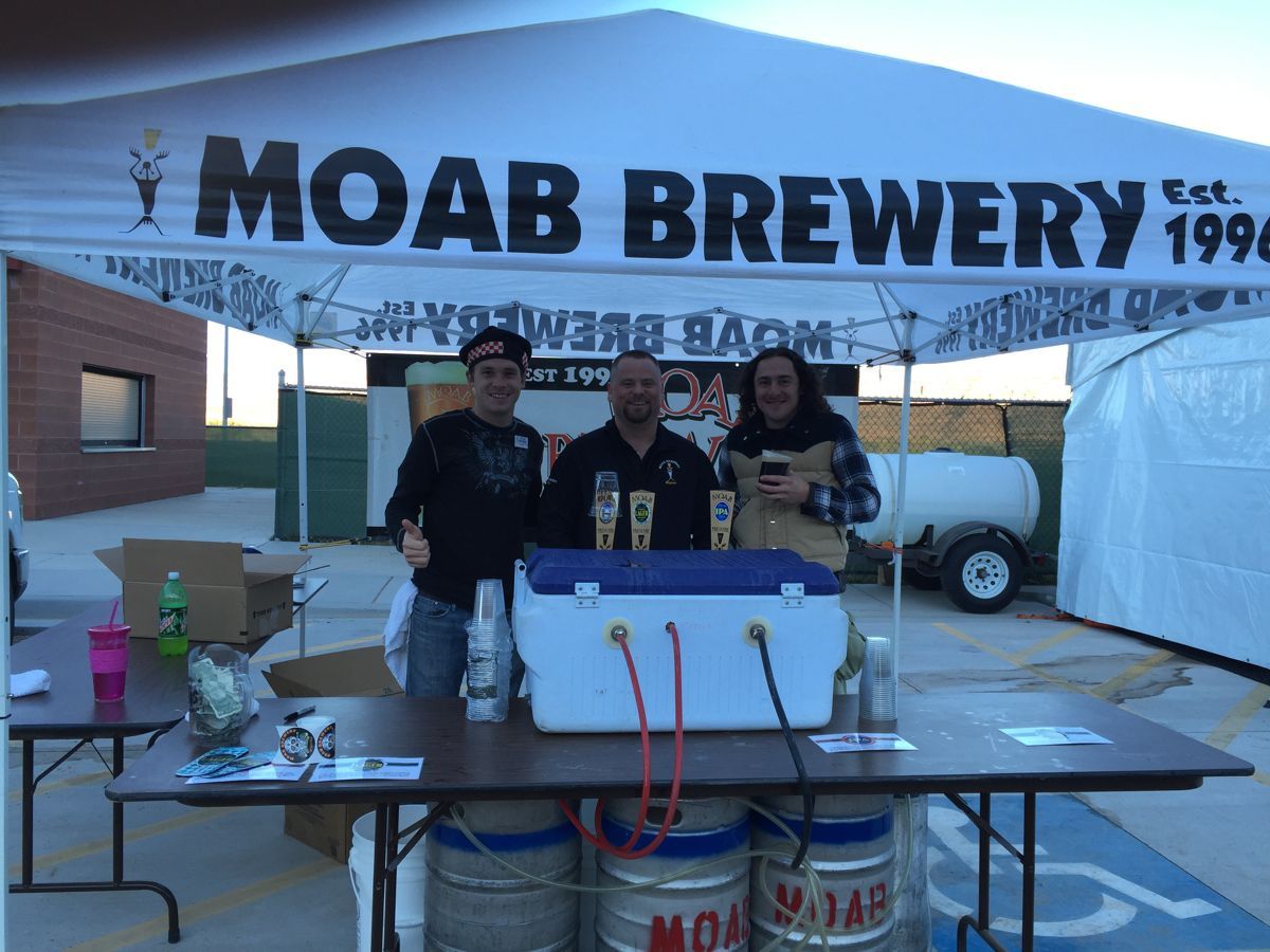 Dillon Bowen working the Moab Brewery pour-over booth at an outdoor event